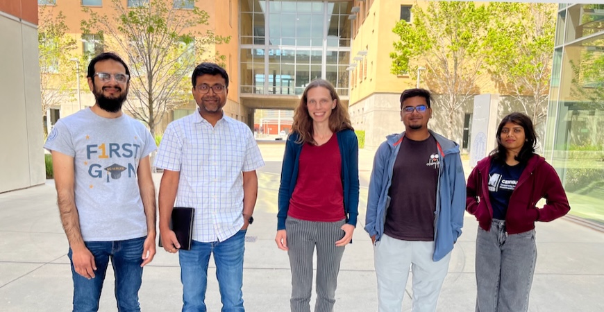 Five faculty and staff stadning in front of Science and Engineering Building 2